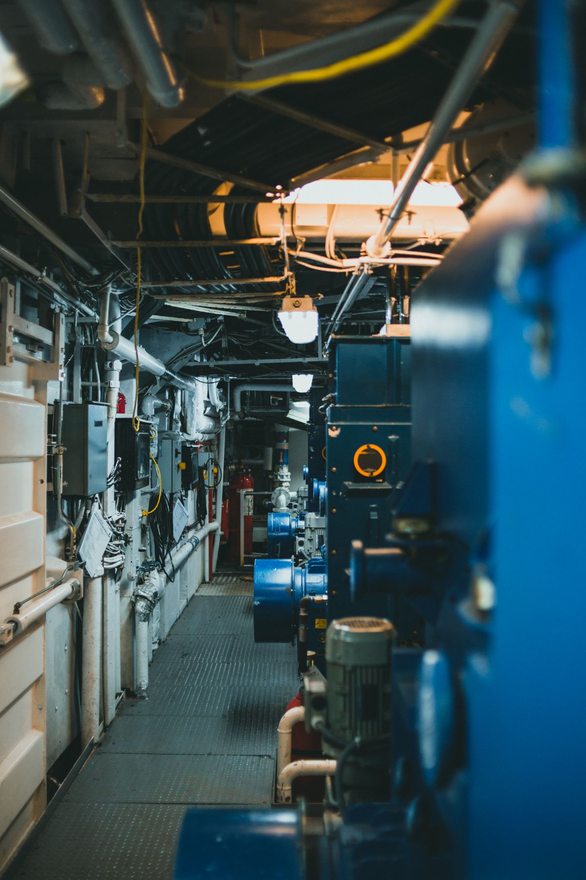 Industrial pipework and machinery running along a maintenance corridor, the pretreatment stages that determine how long a resin bed survives
