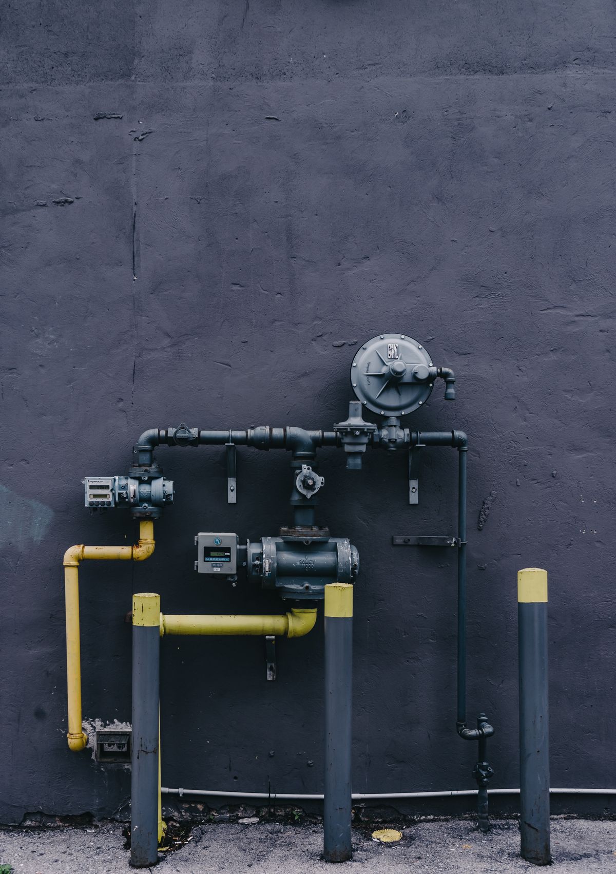 Water filtration equipment and machinery mounted on an exterior wall, the treatment hardware whose performance depends on brine being available when a regeneration starts