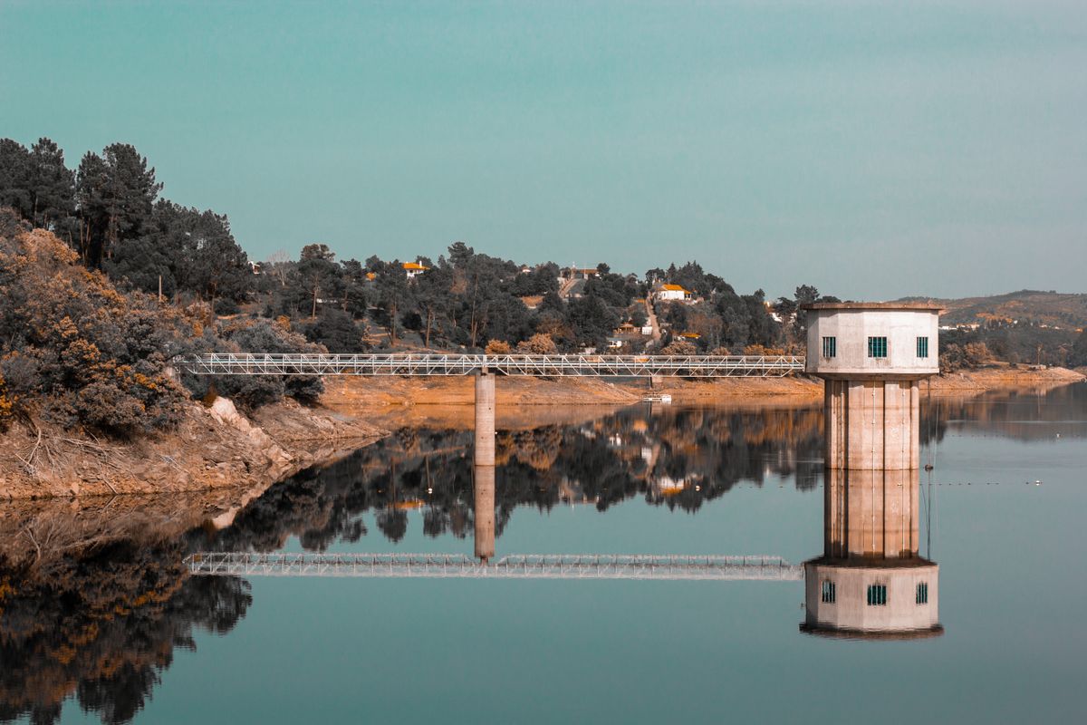 Water intake tower and footbridge on a supply reservoir, a surface source that utilities blend with harder groundwater through the year