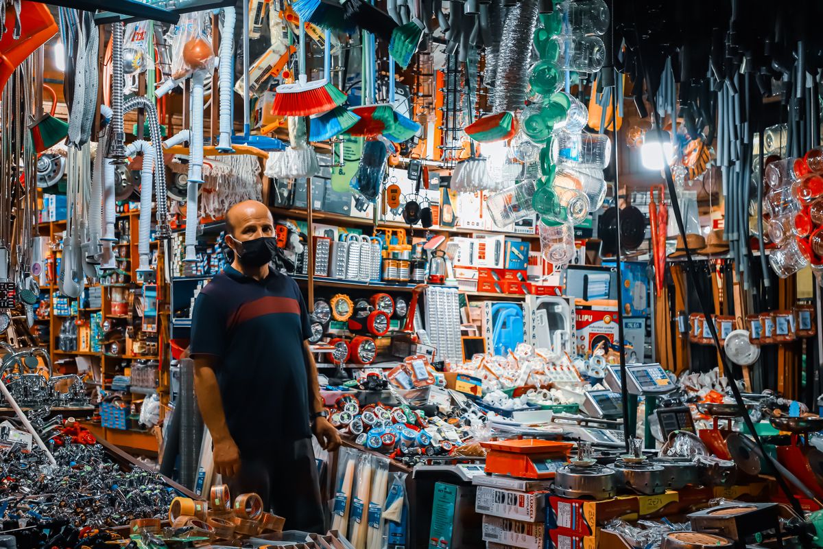Crowded hardware store with tools and household goods stacked on every shelf; EcoPure softeners are sold mainly through hardware retailers as well as Amazon