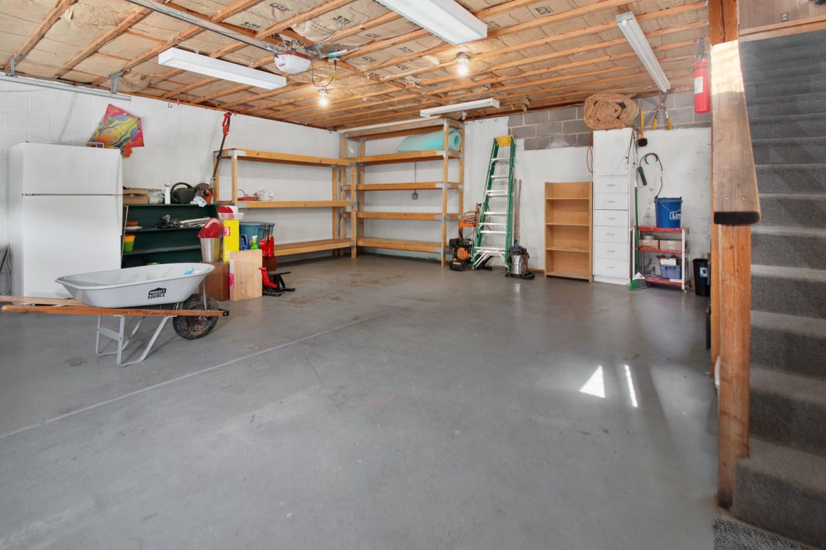 Home garage with storage shelving and tools, a typical location for a whole-house water softener that is running out of capacity early