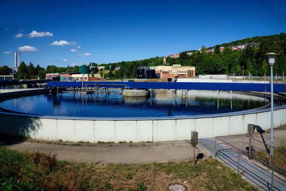 Round secondary clarifier at a wastewater treatment plant, where treated water separates from settled solids before discharge