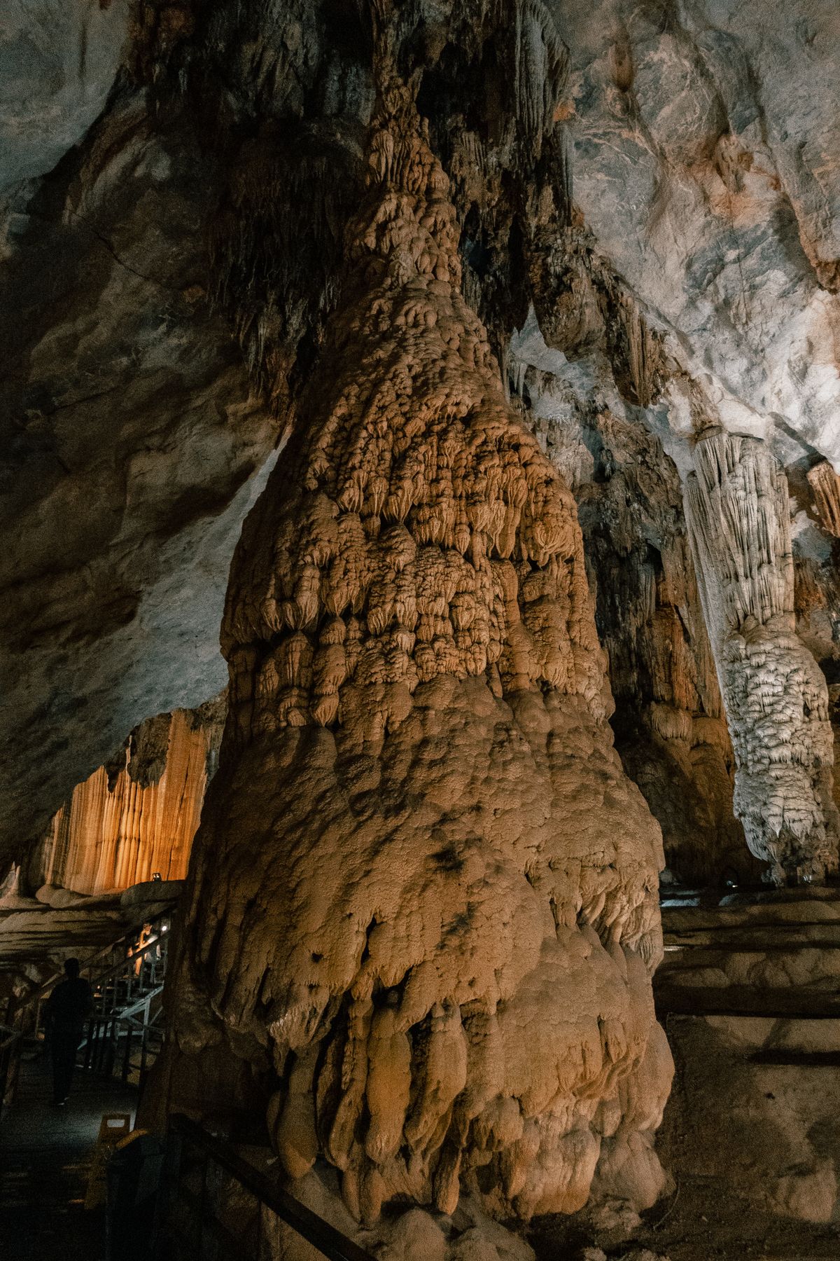 Calcite stalagmite columns in a limestone cave, formed when carbon dioxide escapes and temporary hardness drops out as calcium carbonate