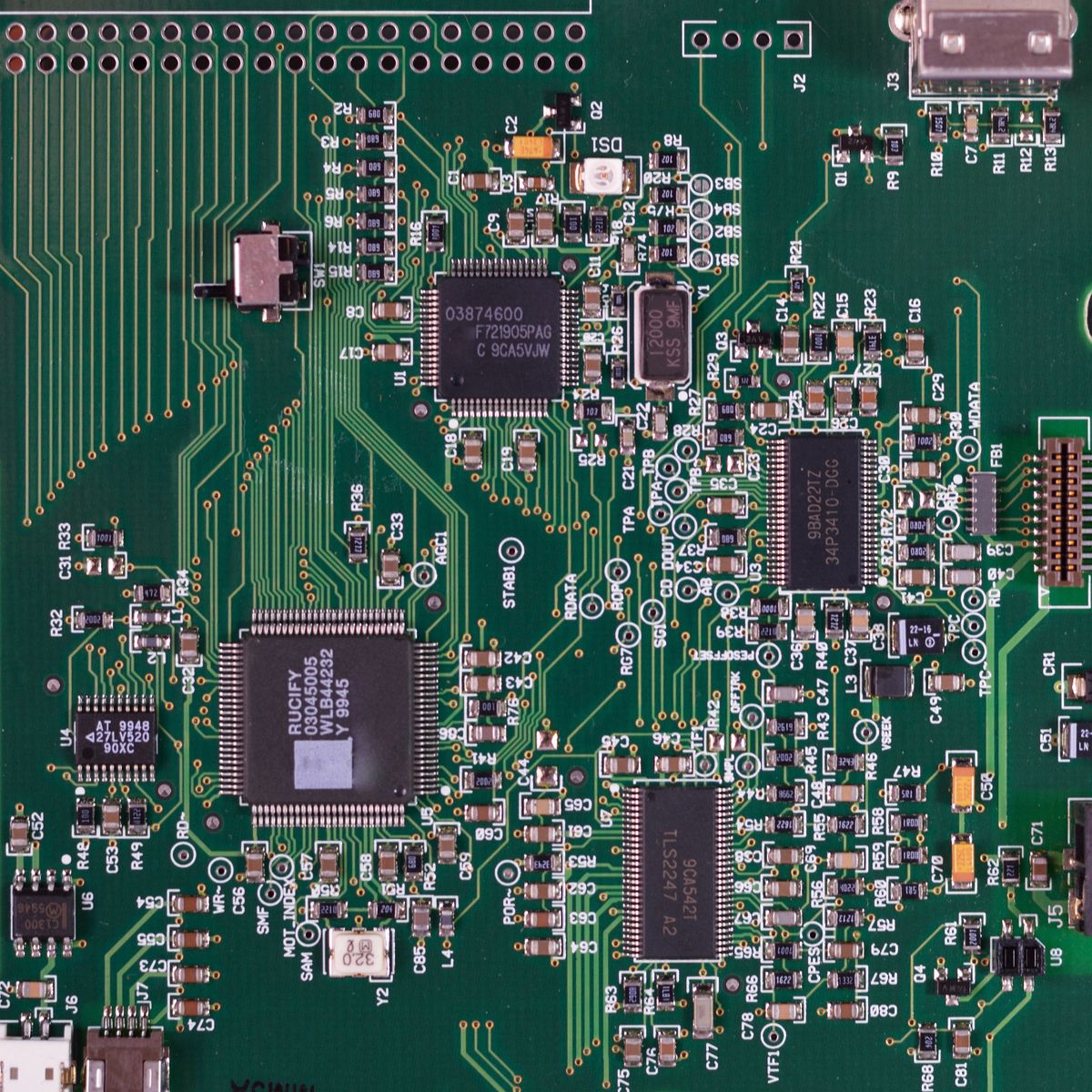 Close-up of a green printed circuit board with rows of electronic components, the kind of controller board whose diagnostics generate a softener error code