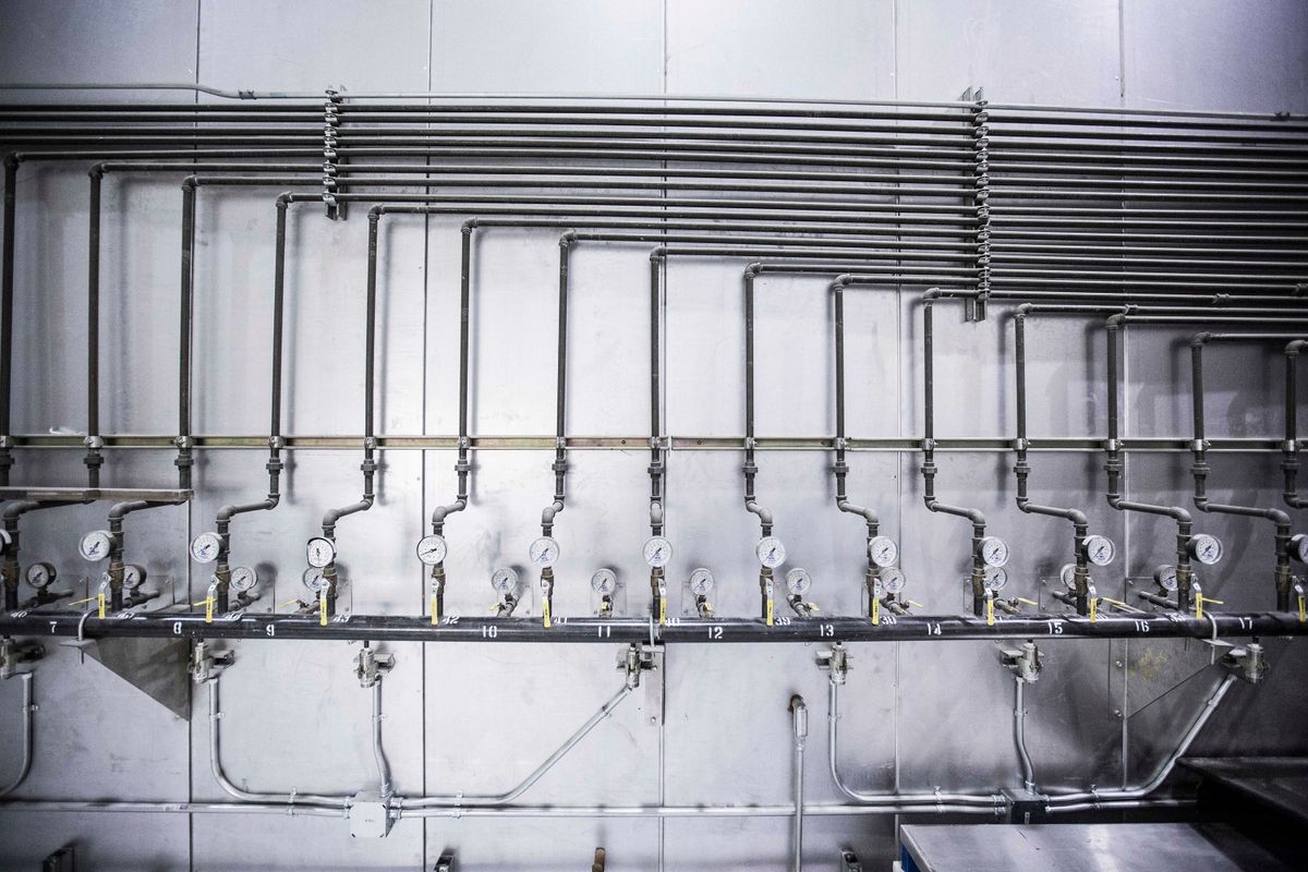 Steel pipework with several pressure gauges mounted in a row, representing the inlet pressure check that confirms a softener injector has enough force to draw brine