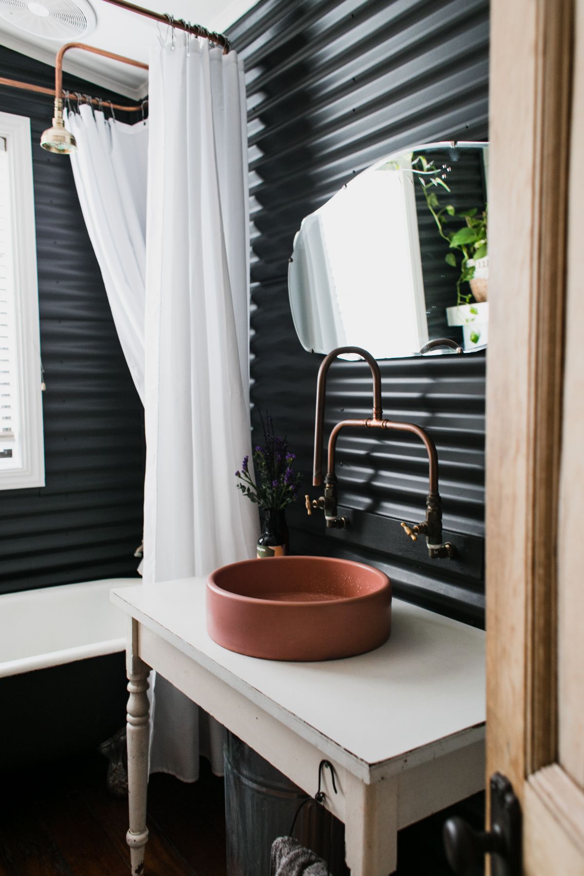 Ceramic bathroom sink with copper fixtures, metalwork to watch for blue-green staining after a pH-lowering system goes in
