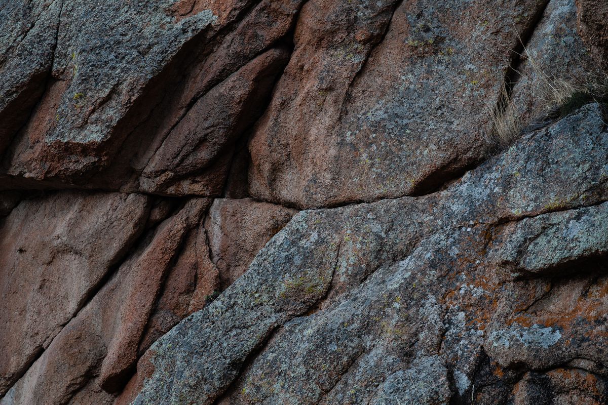 Close-up of rugged granite bedrock, the crystalline rock that produces soft but often acidic well water