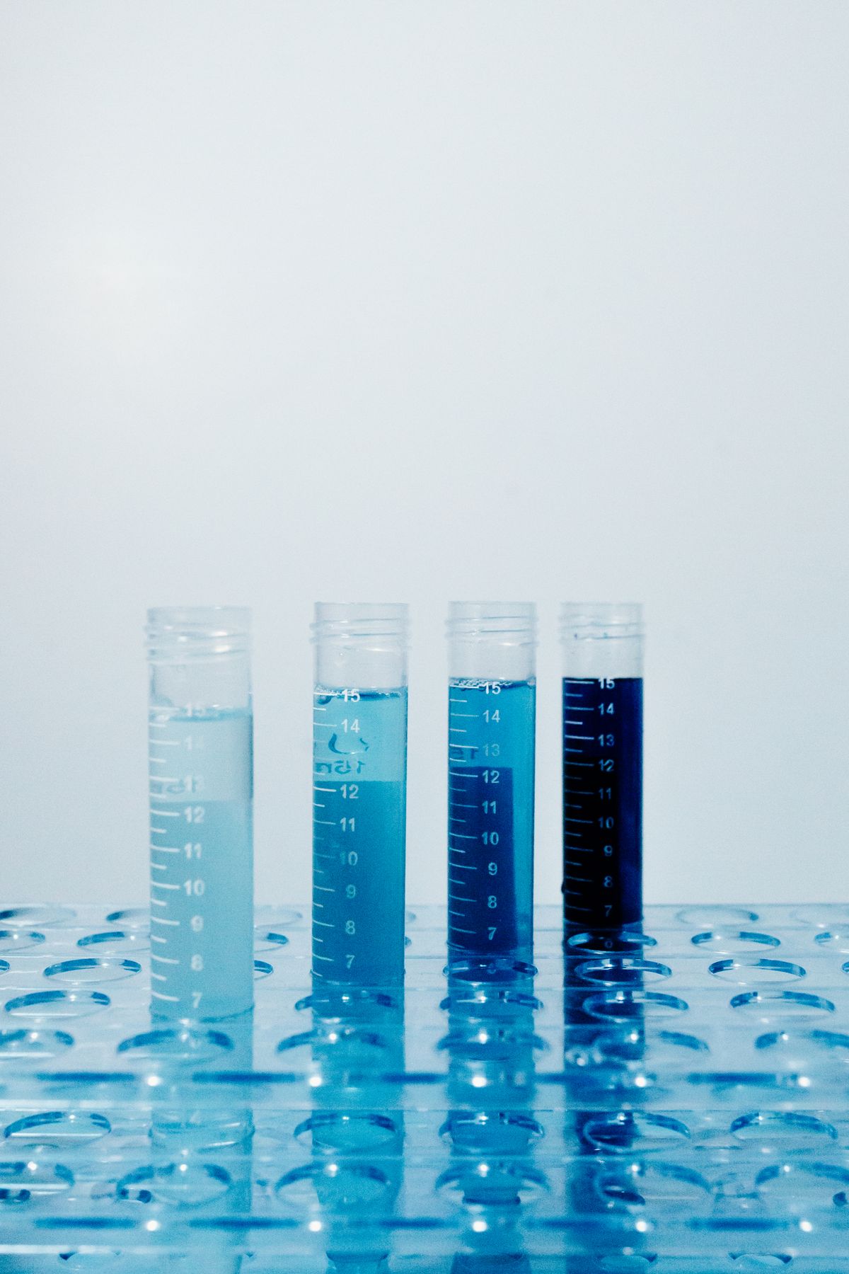 Row of test tubes holding different coloured liquids, a reminder that strip results depend on matching colour against a chart