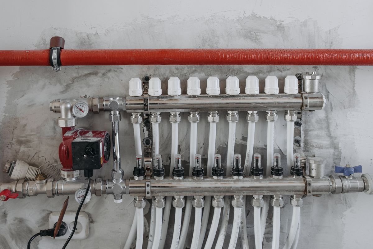 Industrial manifold with pressure gauges and steel pipework