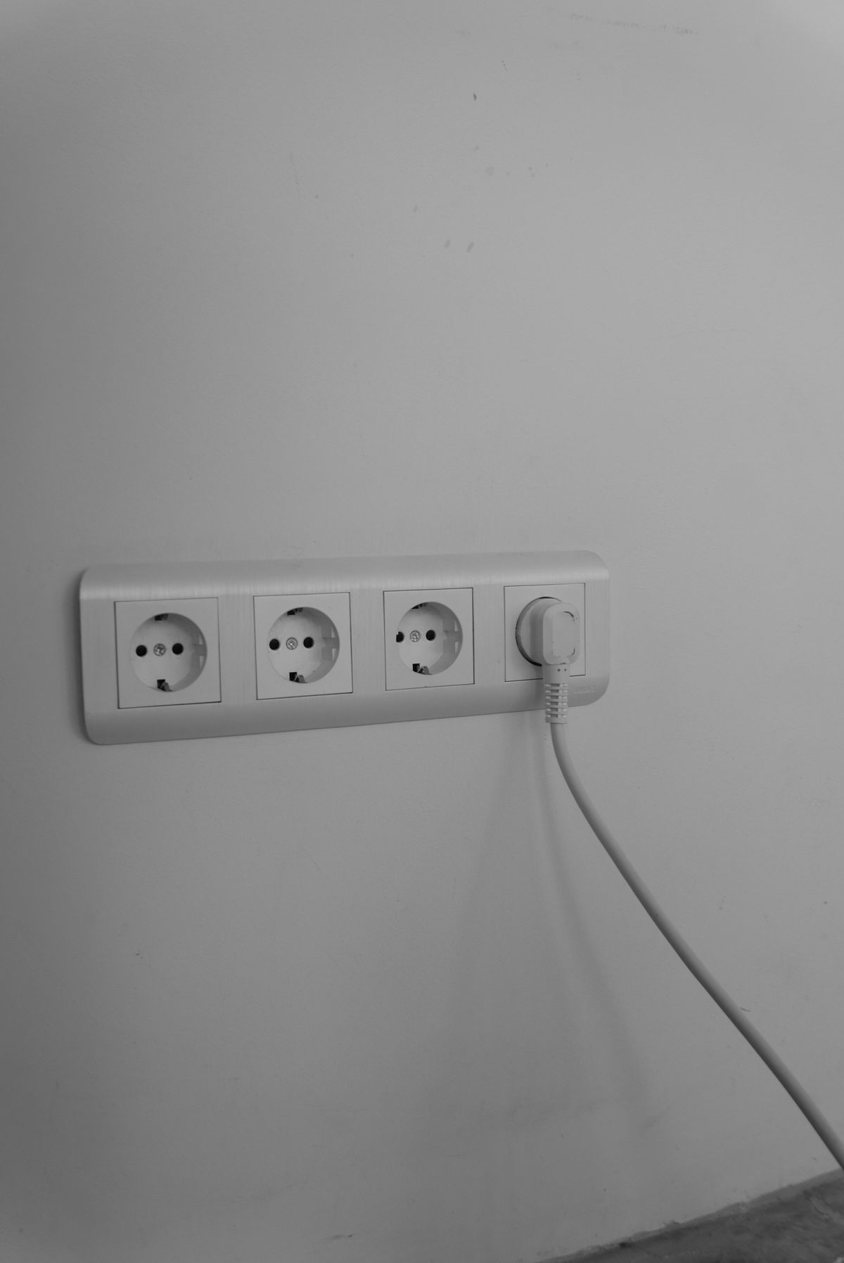 White wall socket with a single plug connected, the first thing to confirm when a water softener control appears to be doing nothing
