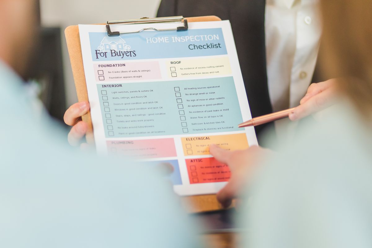 Checklist on a clipboard with a pen, the simple paper log that turns sediment filter changes from guesswork into a measured interval