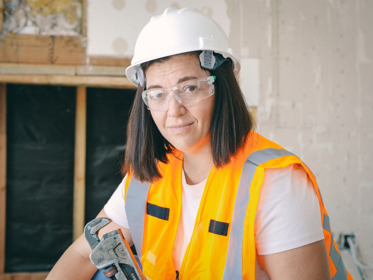 Person holding a plumber's wrench ready for work, the kind of basic tool needed to isolate supply valves before a softener bypass is pulled for O-ring replacement