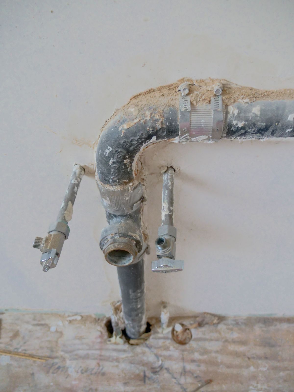 Exposed household plumbing pipework, showing where scale forms when water hardness level is too hard