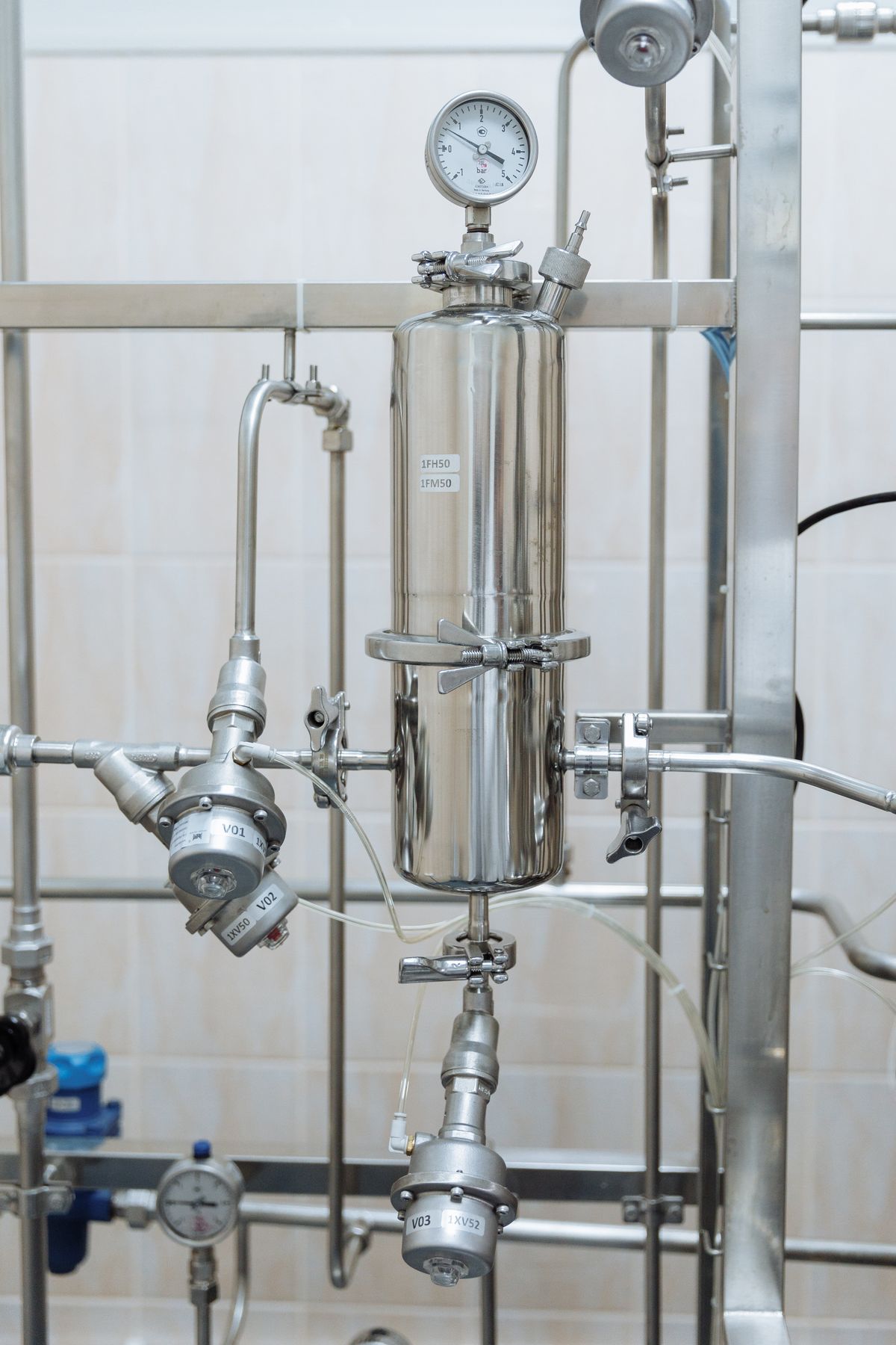 Stainless steel pipe with a pressure gauge, the pressure tank connection where a waterlogged tank or a leak can draw air into a well system