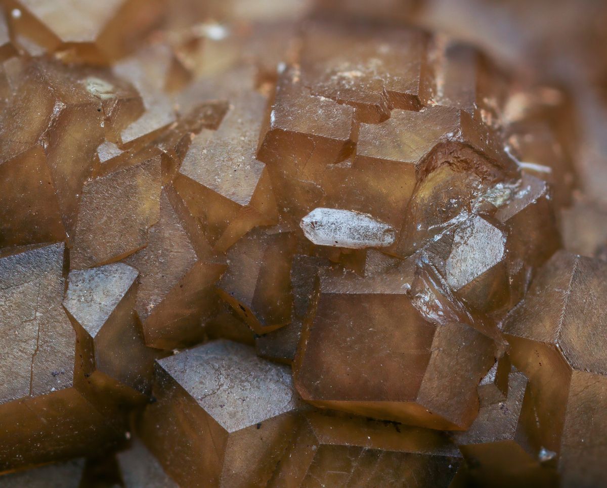 Close-up of brown calcite crystals, the calcium carbonate mineral an acid neutralizer dissolves into acidic well water